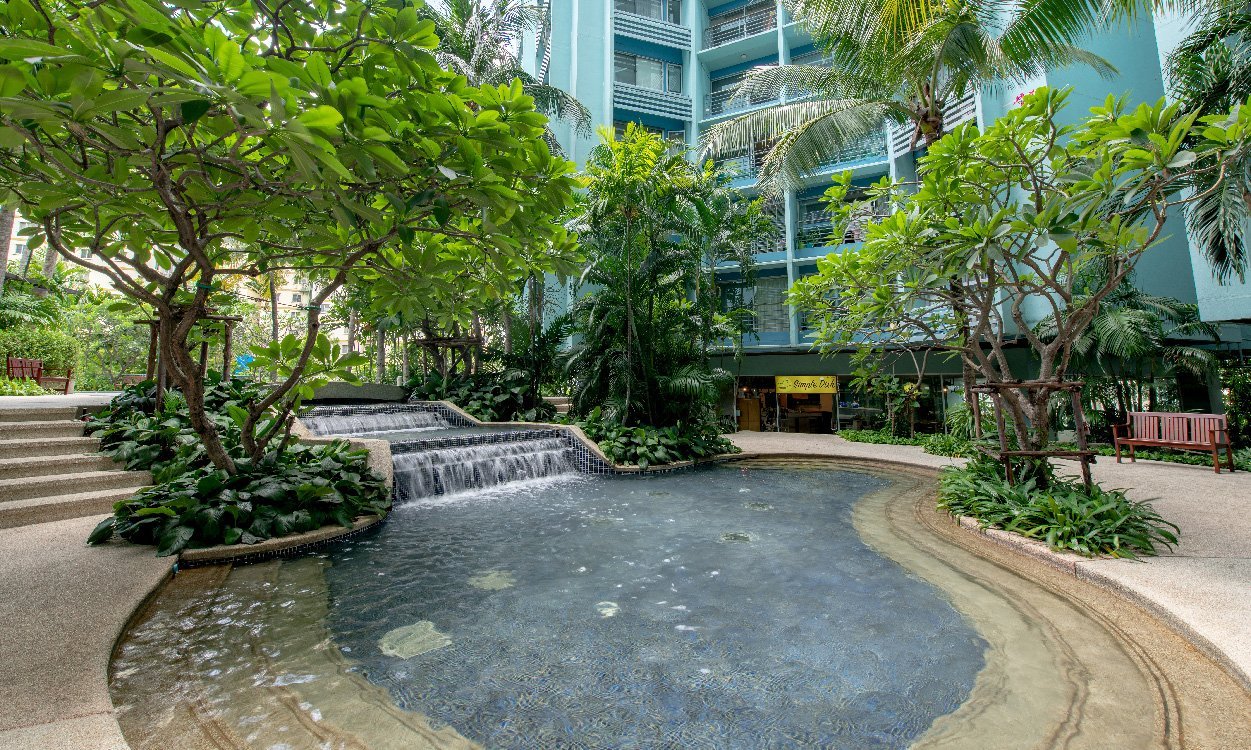 A lush tropical garden creates a kid-friendly space near your apartment.