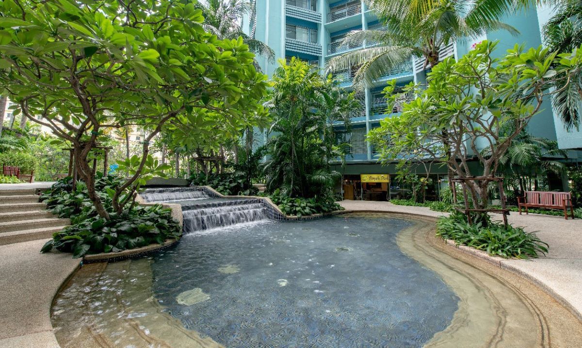 A lush tropical garden creates a kid-friendly space near your apartment.