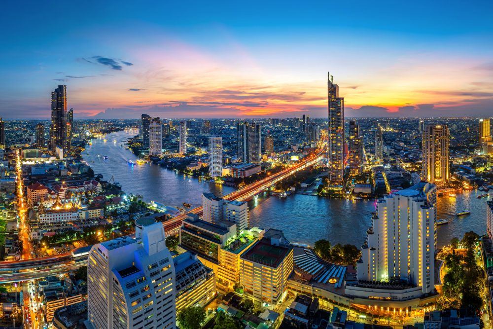 Bangkok skyline at blue hour from a Sathorn rooftop, one of Bangkokâs best photography spots.