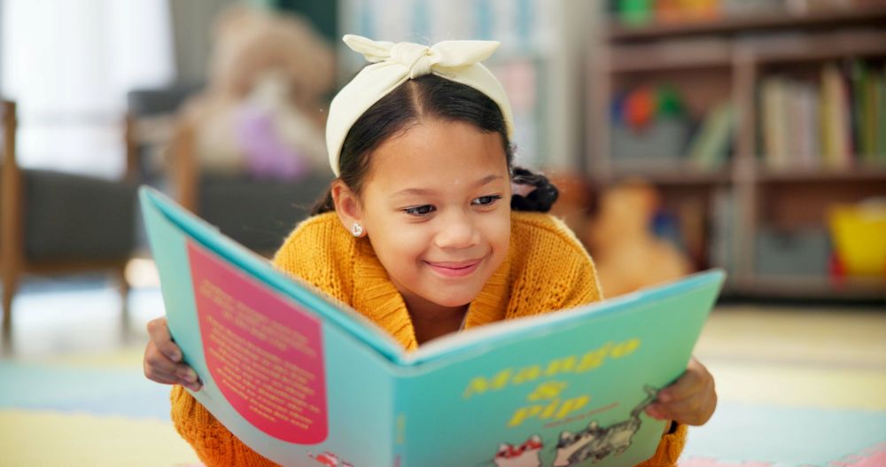 A child reading a book at a kids' library in Bangkok 